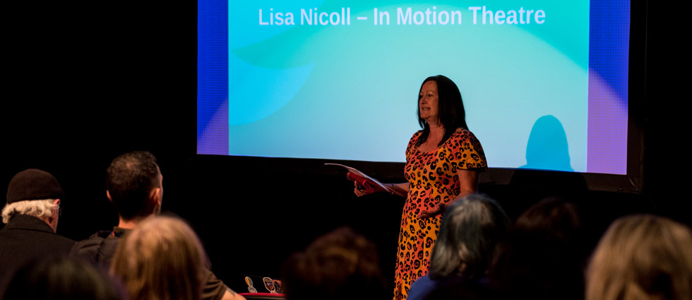 Lisa Nicol speaking at an event