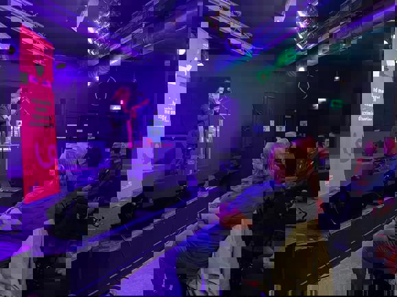 Antje performing at a spoken word event.