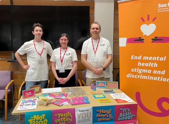 A photo of Gary (right) representing See Me at a wellbeing event.